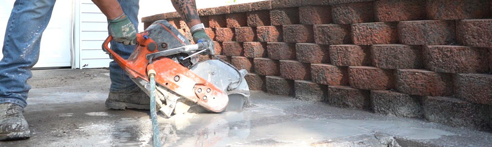FRS crew member cutting concrete.