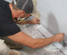 crew installing interior drainage