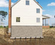 3d cut out of piers stabilizing a home's foundation.