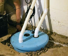FRS crew member installing sump pump.