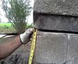 CFI Inspecting Exterior Gap in Bricks
