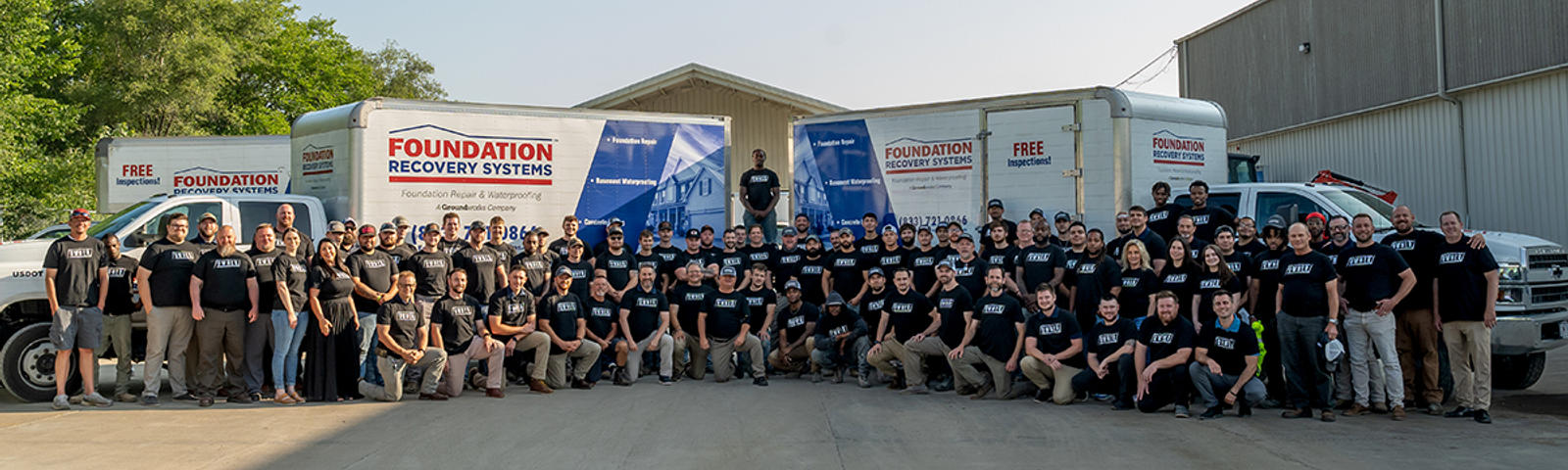 FRS employees standing in front box trucks