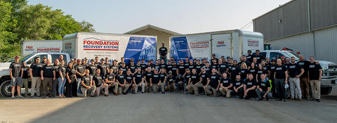 FRS employees standing in front box trucks