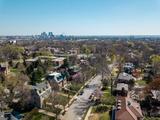 Aerial view of a suburban St. Louis Missouri neighborhood with city skyline, highlighting areas prone to drought foundation damage under a clear sky.