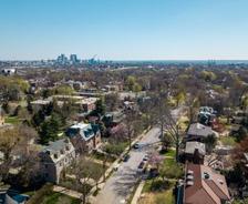 Aerial view of a suburban St. Louis Missouri neighborhood with city skyline, highlighting areas prone to drought foundation damage under a clear sky.
