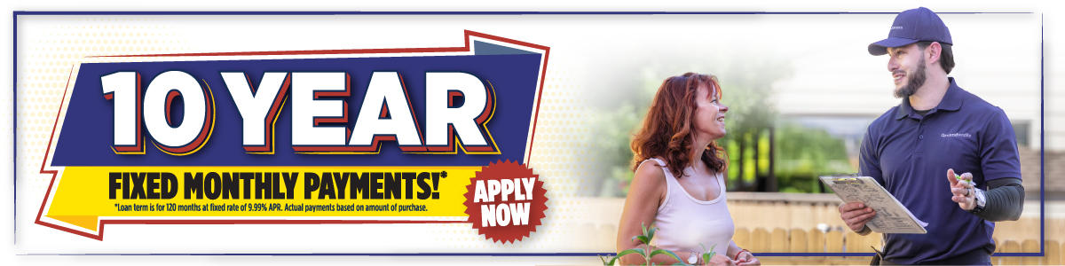 Banner with "10 Year Fixed Monthly Payments*" and "Apply Now" next to a smiling woman and a man in a uniform holding a clipboard.