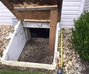 Old access well to crawl space