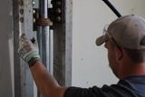crew member installing push piers
