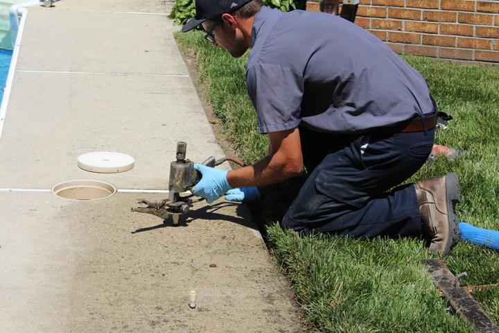 crew installing polyrenewal on sidewalk