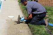crew installing polyrenewal on sidewalk
