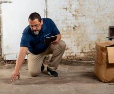 inspector evaluating a wet basement
