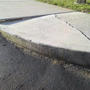 Cracked concrete sidewalk before