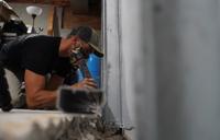 Crew installing basement drain.