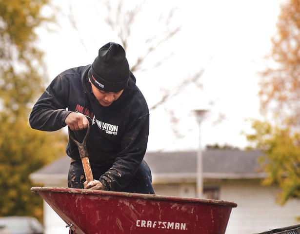 IFS crew with wheelbarrow and shovel
