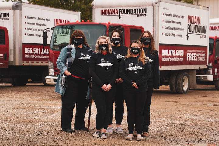IFS Admin in COVID mask outside with supply truck