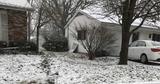 snow covering yards next to house foundations
