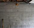 Horizontal cracked interior basement wall.