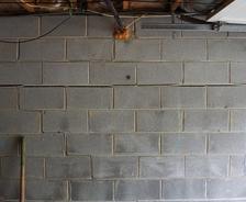 Horizontal cracked interior basement wall.
