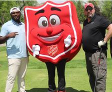 Indiana Foundation Service teammates with the Salvation Army mascot at the Golf 4 Kids tournament