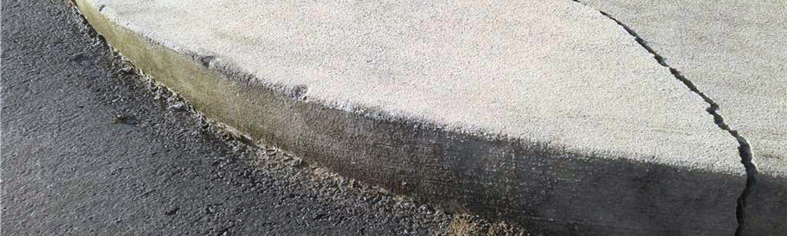 Cracked concrete sidewalk - before