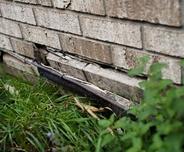 Exterior bowing brick wall.