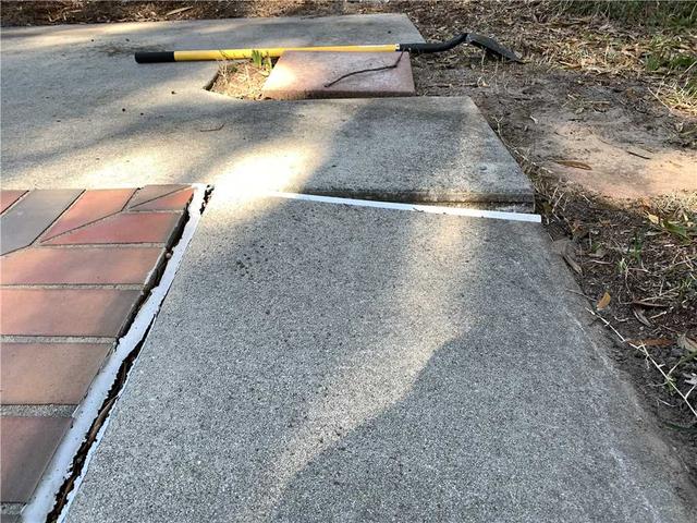 cracking, uneven concrete around pool