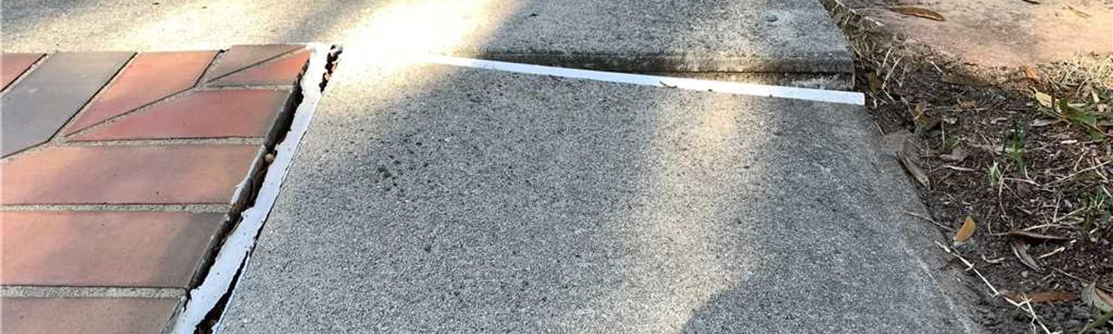 cracking, uneven concrete around pool
