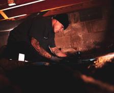 Crew member working in crawl space