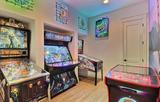 arcade machines and other games in basement