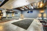 large basement gym with mirror wall
