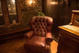chair in the corner of a small man cave