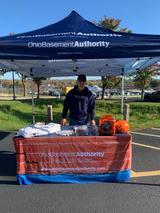 Ohio Basement Authority staff in a booth at the Spook-tacular Fall Family Festival in Twinsburg