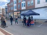 crowd walking by the Ohio Basement Authority tent at Tricks and Treats at Crocker Park