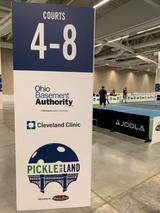 Ohio Basement Authority sponsorship sign at the annual Pickle in the Land pickleball tournament