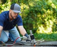 crew member repairing concrete with polyurethane injections