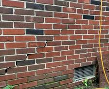 stair-step cracks in brick wall