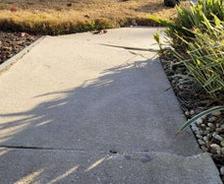 cracking and uneven sidewalk
