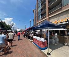 the Ohio Basement Authority tent and attendants at the 2025 ESPN Cleveland Block Party