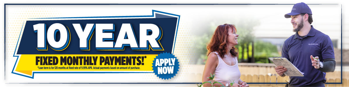 Banner advertising 10-year fixed monthly payments; a woman talks with a contractor holding a clipboard.